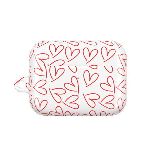 Back side of glossy white AirPods case with red heart print pattern, showing carabiner loop and seamless protective fit
